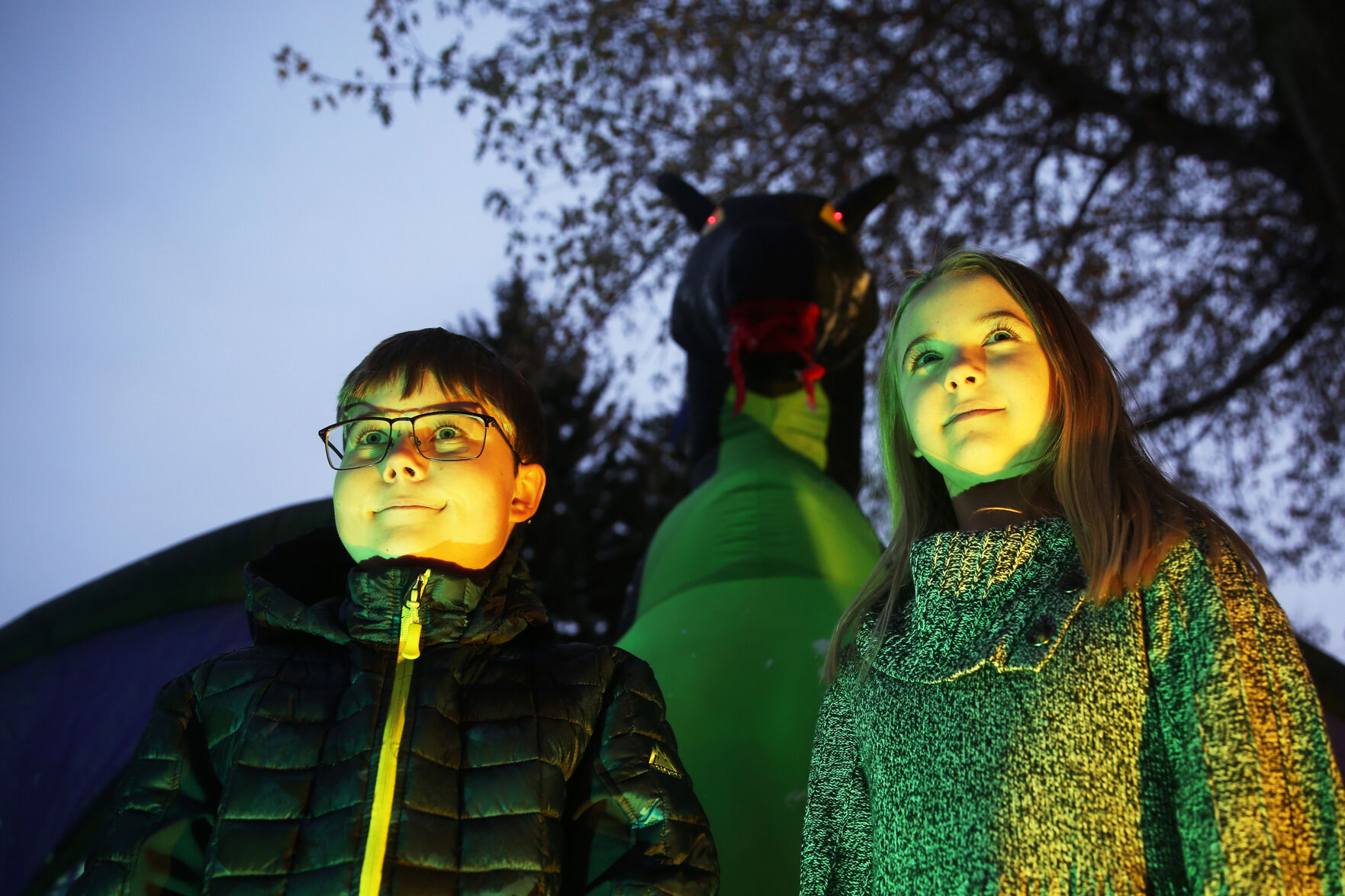 Darton Damone, 12, and his sister Jorgie, 10, pose with their fully inflated dragon